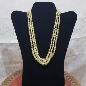 Three strand pearl and gold bead necklace